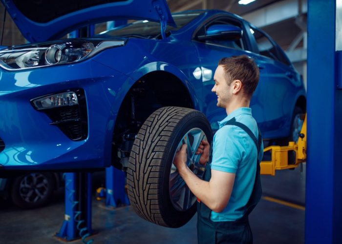 worker-removes-wheel-from-vehicle-car-service.jpg